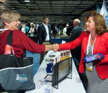 Emery DeWitt  Program Manager disseminating information at SCATE booth